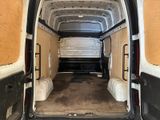 a white van that is parked inside of a building
