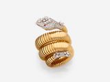 a close up of a gold snake ring with diamonds on a white background