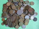 a pile of coins sitting on a green surface