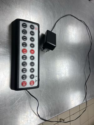 a remote control that is attached to a wall