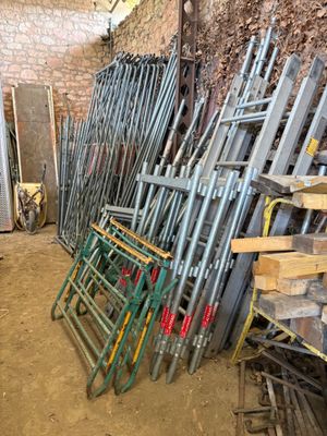 a lot of chairs and ladders in a room