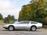 a silver sports car parked on the side of the road