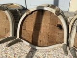 three wine barrels that are sitting on the floor