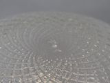 a close up view of a glass plate with water droplets on it