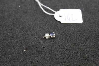 a small piece of jewelry that is on the ground