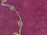 gold plated necklace with a blue glass bead and a gold plated chain