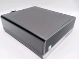 an image of a black computer on a white surface