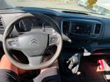 someone is driving a car with a steering wheel and a dash board