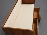 an image of a wooden bed with a drawer underneath it