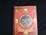 a red book with a picture of a man riding a horse
