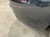 a close up of a car ' s bumper with a sticker on it