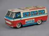 a toy bus that has people on the side of it
