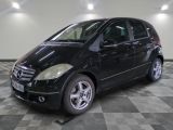 a picture of a black mercedes b - class parked in a garage