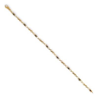 a close up of a gold chain bracelet with black beads