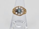 an image of a close up of a ring on a clear ring holder