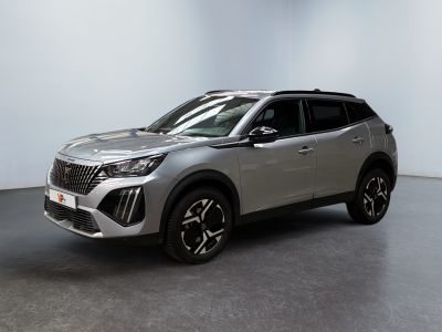 a silver suv parked in a room with a white wall