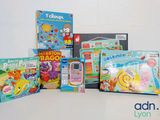 many children ' s toys and books on the table