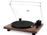 une photo d'un tourne-disque posé sur une table en bois
