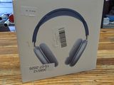 packaging of a pair of headphones sitting on a wooden table