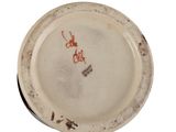 a white plate with a red design on it