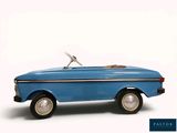 a toy car that is sitting on a white surface
