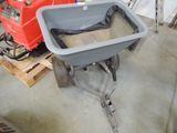 a red and a gray wheelbarrower in a garage