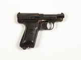 a black gun on a white surface with a white background