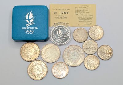 a box of coins sitting next to a small box of coins