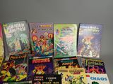 a lot of comic books sitting on a table