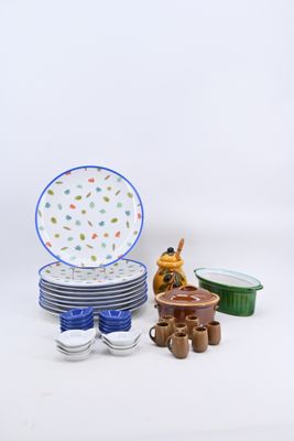 many plates and bowls that are sitting on a table