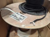 a table with a cable and a spool on top of it