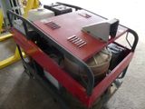 a red cart with a red table on it