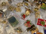a lot of pins that are laying on a table