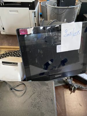 a laptop computer sitting on top of a desk next to a printer