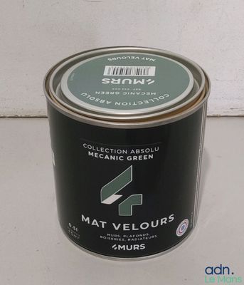 a can of paint sitting on a counter top