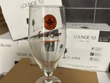 a wine glass sitting on top of a cardboard box