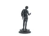statue of a man with a book in his hand on a white background