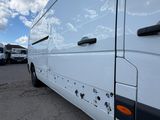 a white van that is parked in a parking lot