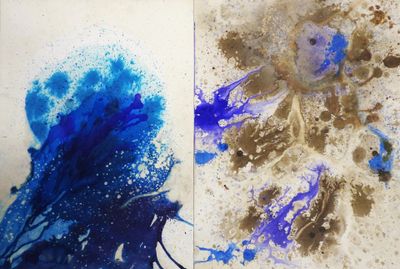 two pictures of blue and brown paint on a piece of paper