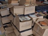many boxes stacked on top of each other in a room
