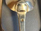 two spoons and a fork on a table