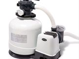 an image of a sand filterer with a hose attached to it