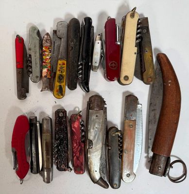 many different types of pocket knives on the table