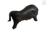 a black sculpture of a cow on a white background