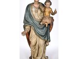 an image of a statue of a woman holding a child