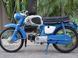 a blue motorcycle parked on the side of the road