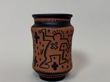 a close up of a vase with a design on it