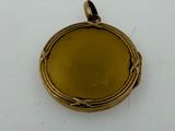 an image of a gold locke on a white surface