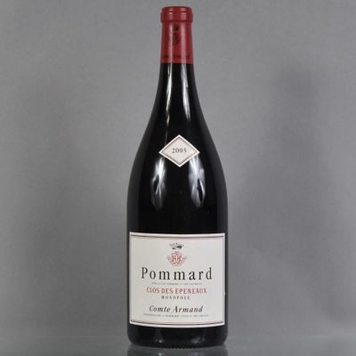 the bottle of red wine is sitting on the table