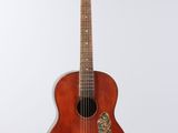 an image of a guitar hanging on a wall on a white background